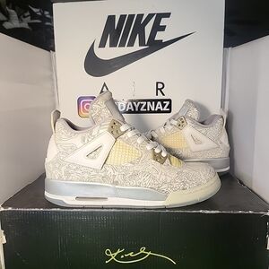 The Nike Air Jordan 4 Laser GS Size 6.5Y (8 Wmn) Sneakers in White Laser are sty